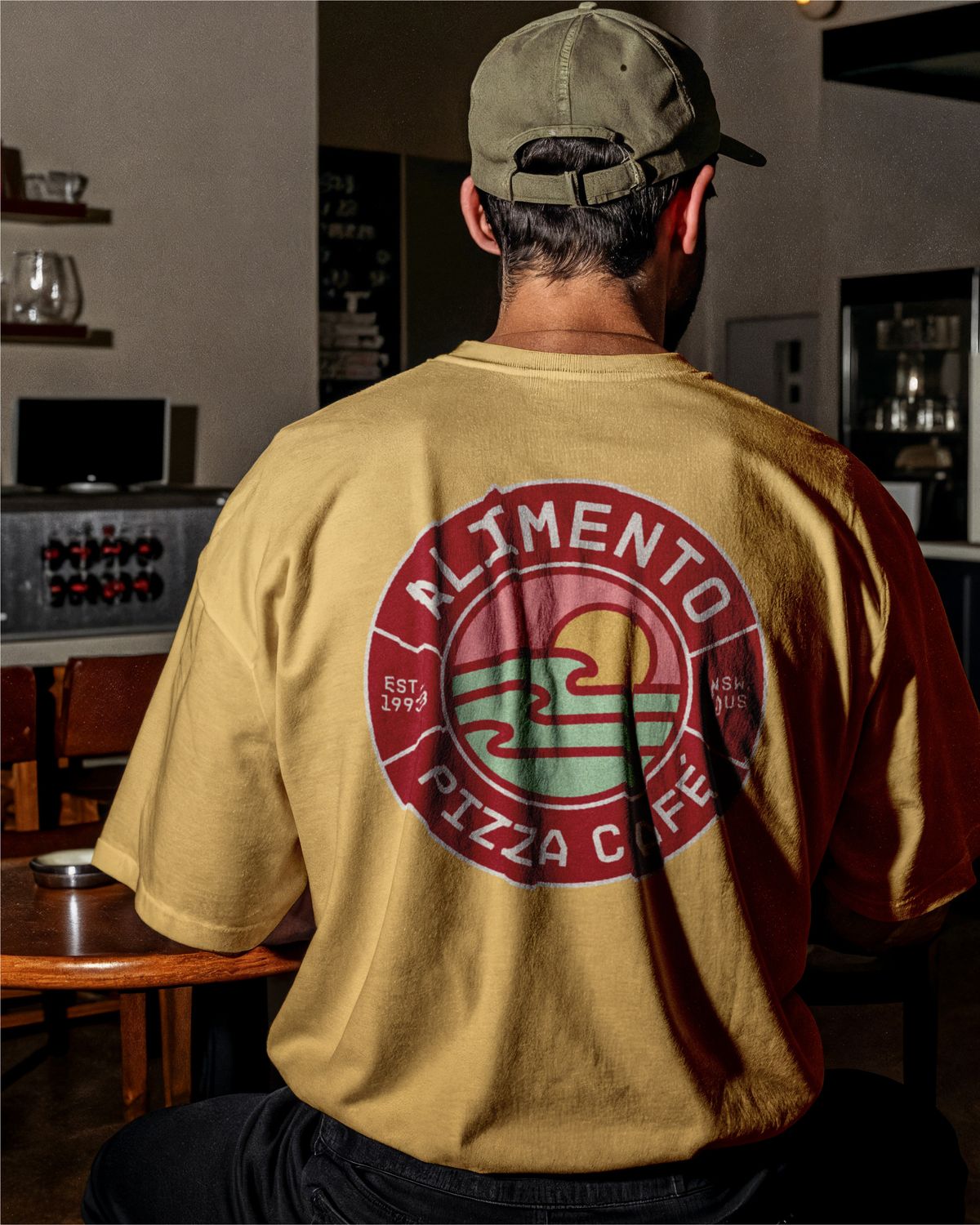 Alimento tee with the badge printed on the back